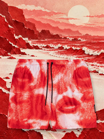 De rood met witte zwembroek Noir aan de kust van een zee van golven van rood en wit papier, onder een bleke zon.